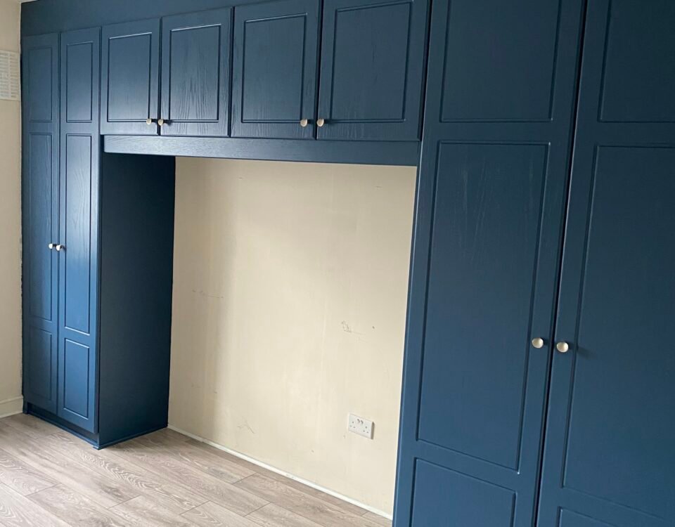 Spray painted wardrobe in F&B Stiffkey Blue